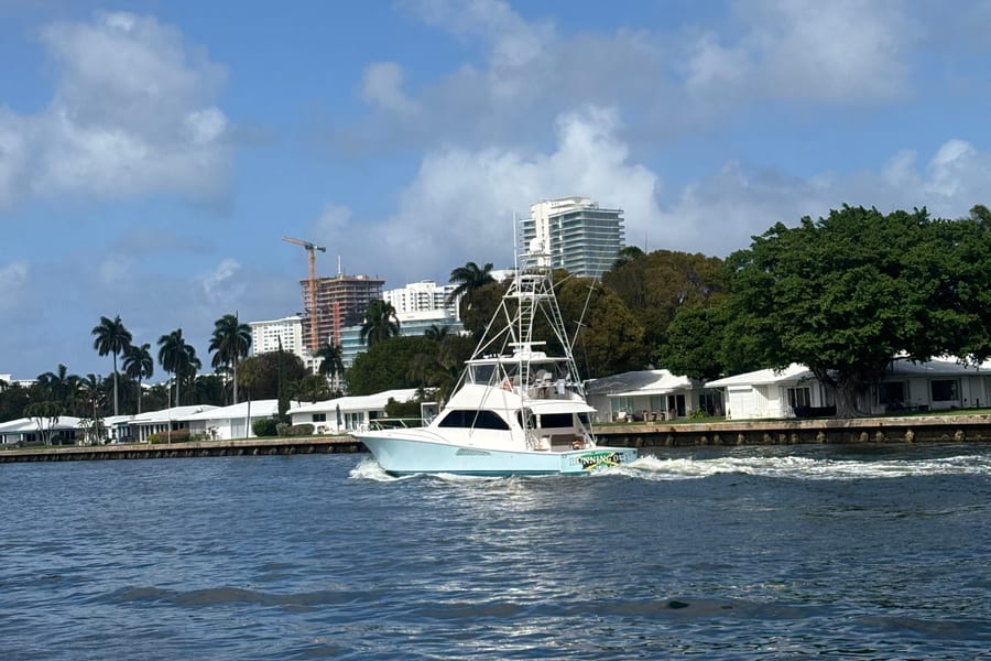 Sportfish boat with a tower running on the Intracoastal Waterway