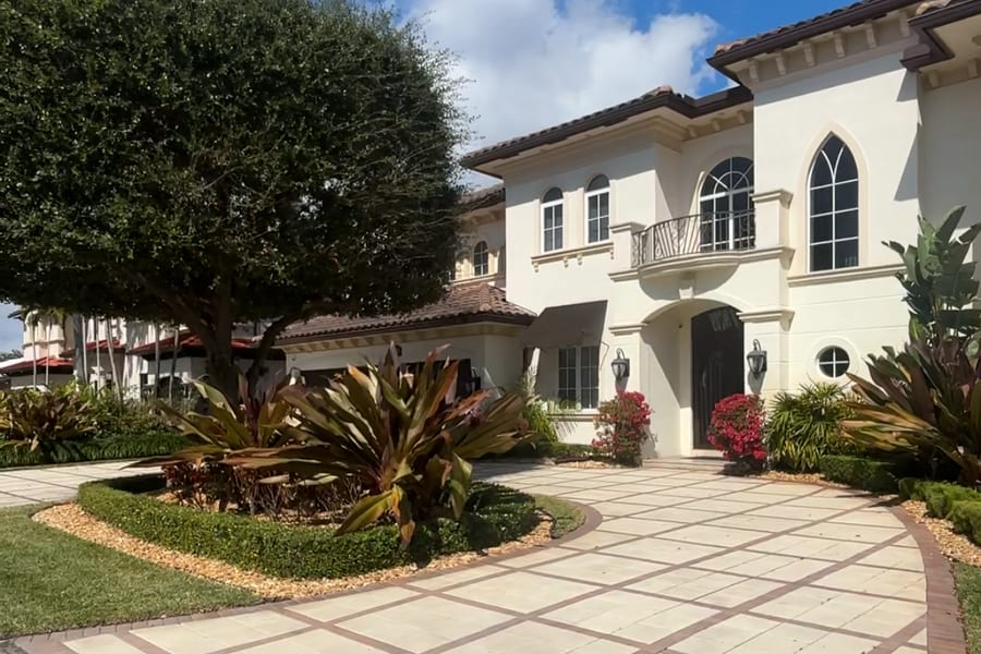 Mediterranean style estate with a paver driveway in Coral Ridge, Fort Lauderdale