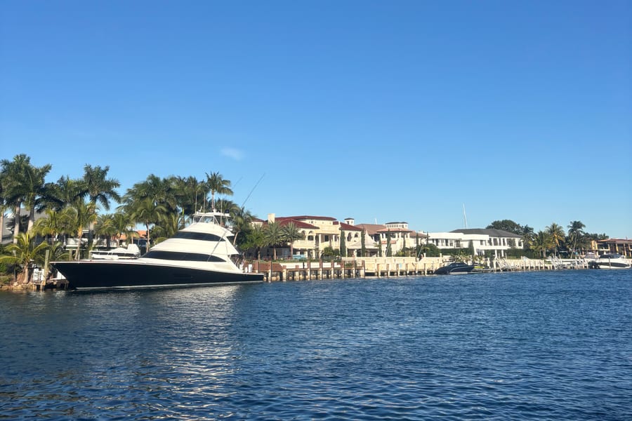 Waterfront homes and docks seen across the water near Lighthouse Point