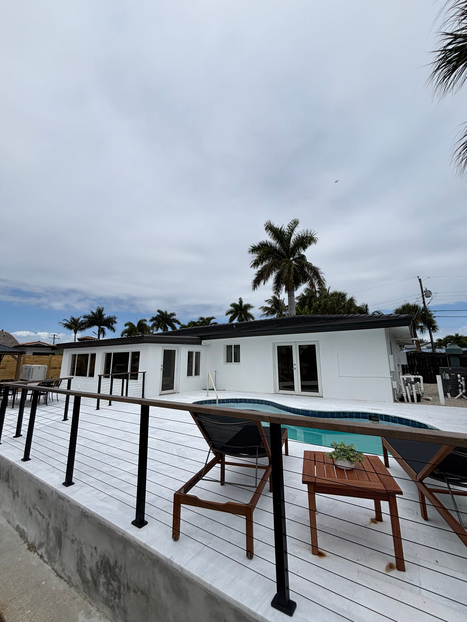 Waterfront home terrace overlooking a canal in East Pompano Beach