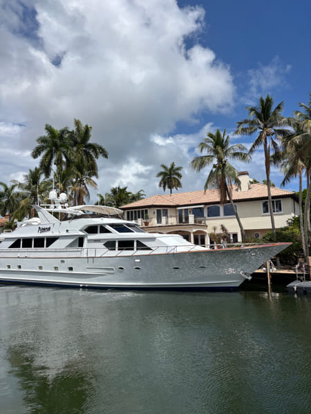 Motor yacht docked behind a waterfront home on a Fort Lauderdale canal